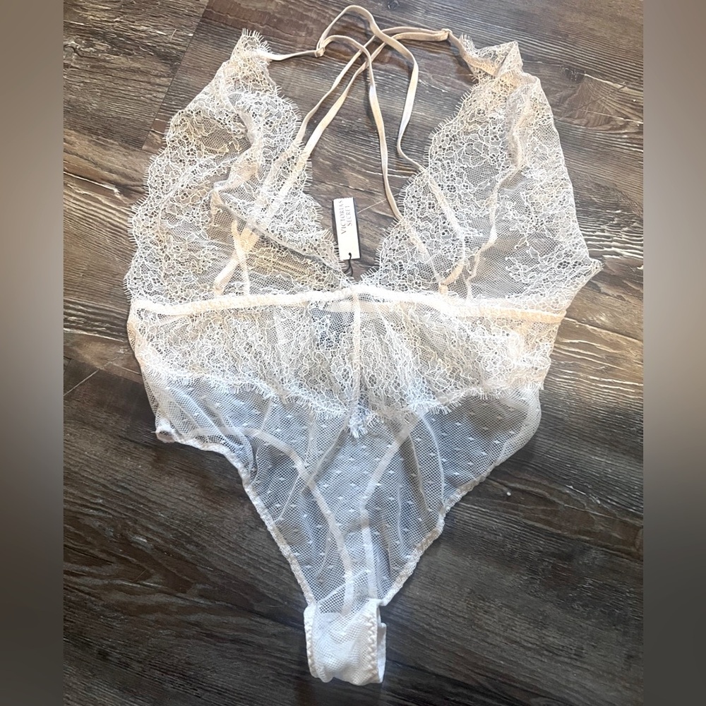 Victoria’s Secret pale pink teddy, new with tags. Size medium.